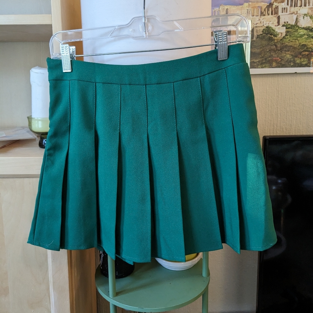 Green pleated skirt